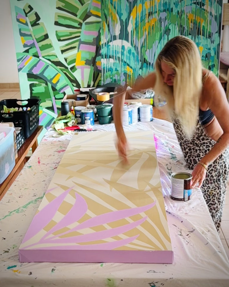 artist pepallama painting an original on canvas in her studio in Costa Rica