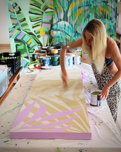 artist pepallama painting an original on canvas in her studio in Costa Rica