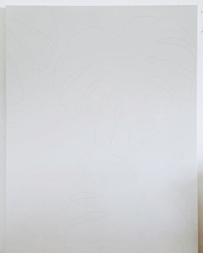 live painting tropical monstera leaves on a large canvas by pepallama in her studio in Costa Rica 